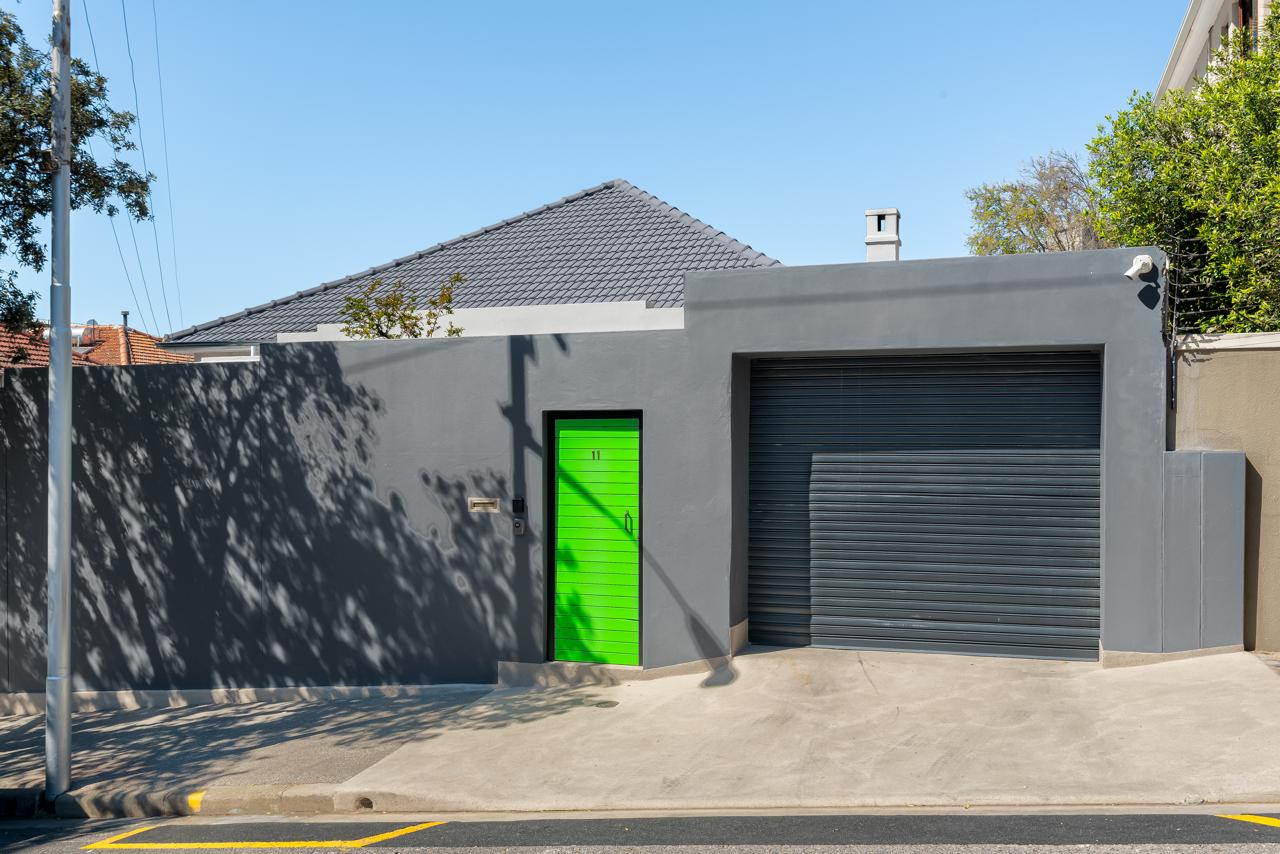 Modern charcoal exterior with bright green door