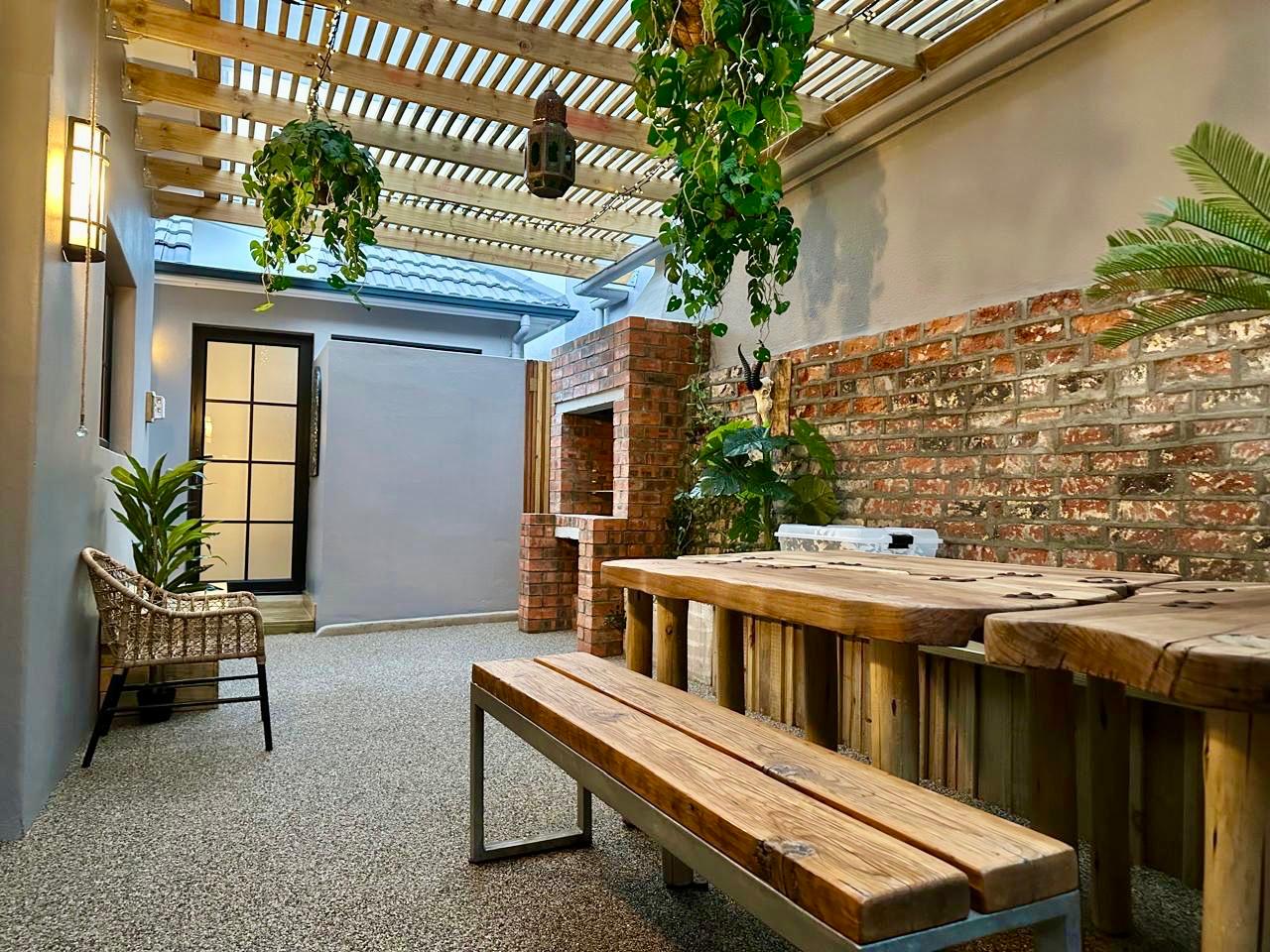 Timber pergola and brick braai area