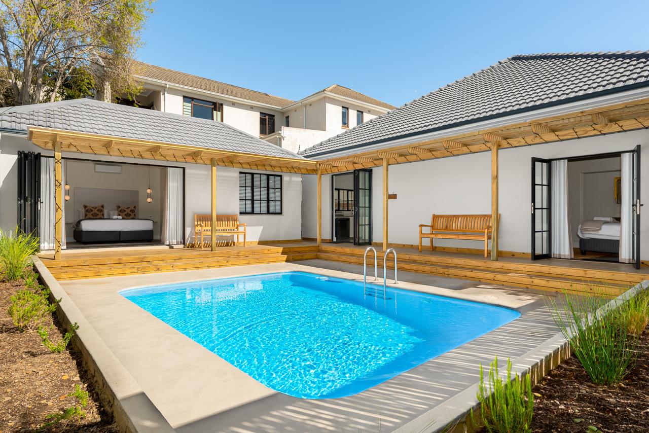Pool courtyard with timber decks and covered outdoor rooms